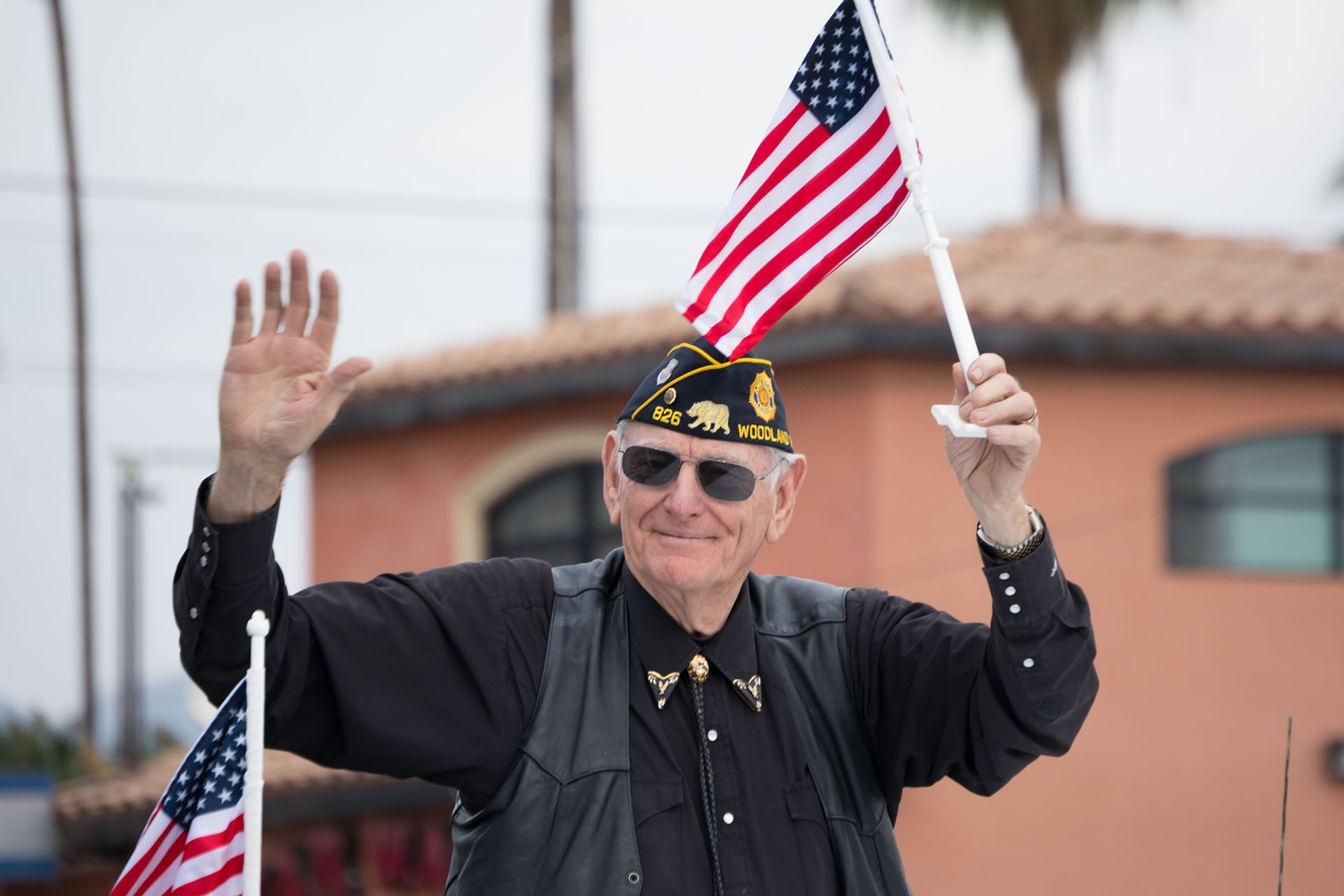 Veteran holding flag and waving